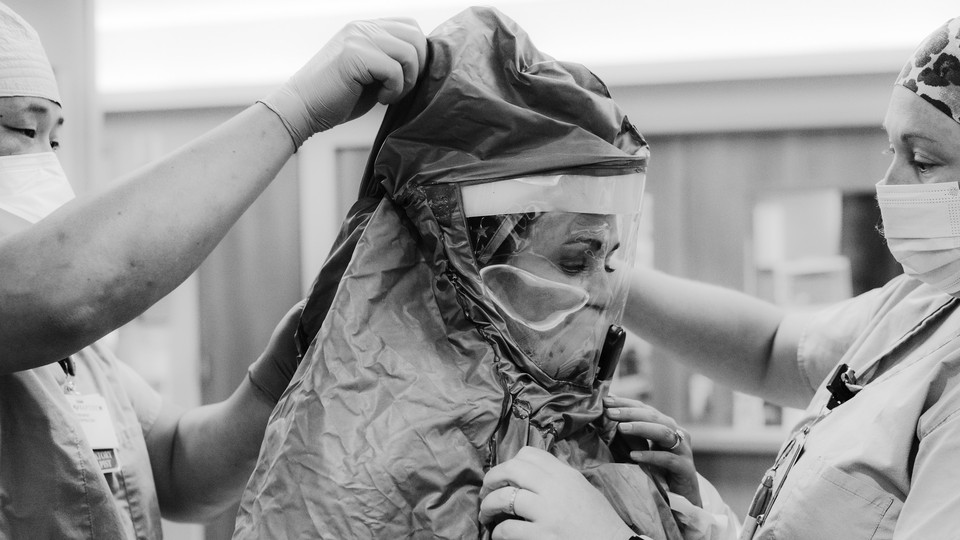 An Arkansas nurse prepares to treat a COVID-19 patient.