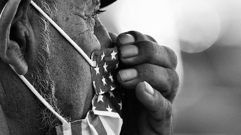 Man wearing an American flag facemask