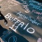 A photograph of the names of the Buffalo-shooting victims chalked on a blacktop