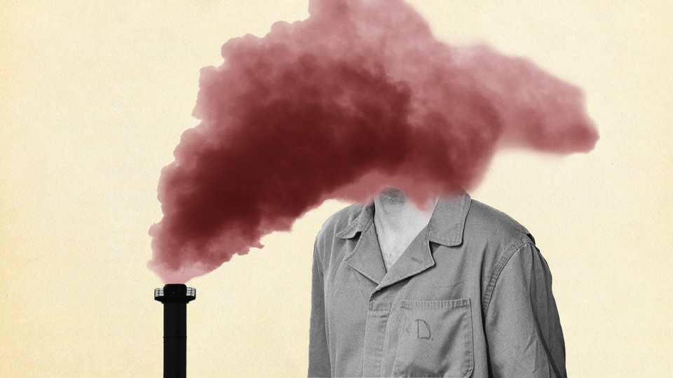 A smokestack pours a cloud over a person's face