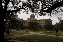 A stately university building is photographed on a slightly overcast day