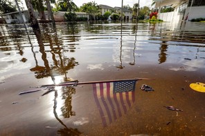 An American flag is submerged in floodwaters in Florida after Hurricane Helene swept over the Southeast United States.
