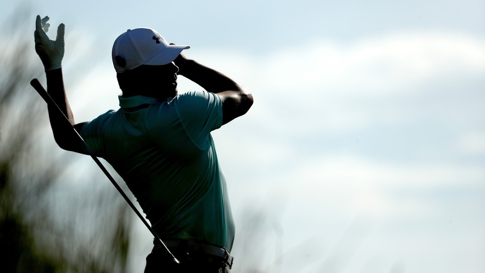 The professional golfer Gary Woodland loses grip of his club during a swing.