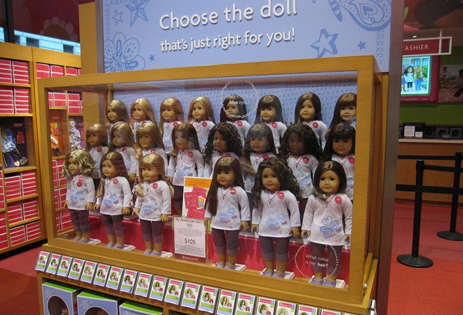 photograph of American Girl dolls on display