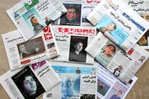 A picture taken in Tehran shows the front pages of Iranian newspapers bearing portraits of Maryam Mirzakhani.