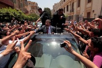 Mohamed Morsi greets supporters during Egypt's June 2012 presidential election.