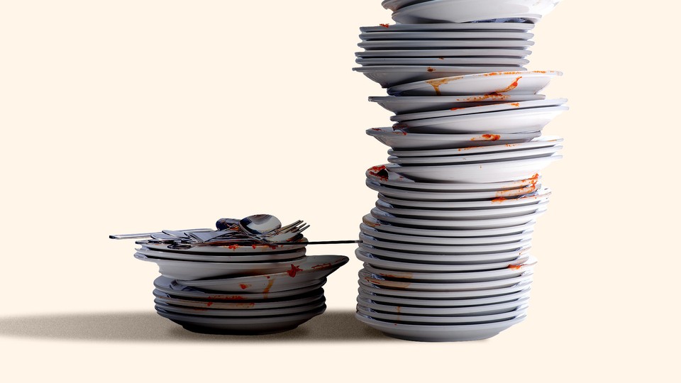 An image of two stacks of dirty plates, one towering over the other
