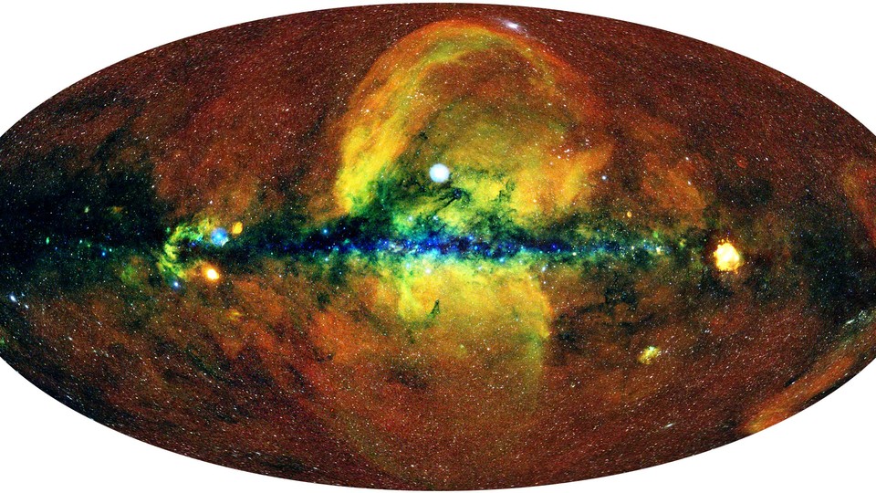 An X-ray view of the entire sky, in which giant bubbles are clearly visible extending above and below the plane of the Milky Way galaxy