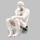 illustration of oversized white "Thinker" sculpture resting on small black schooldesk chair on gray background