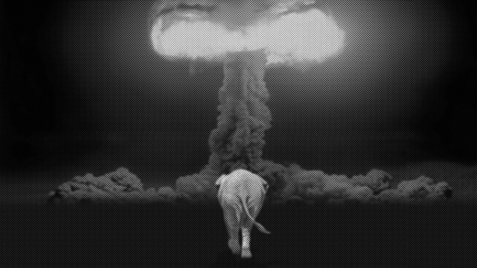 A photo-illustration of an elephant walking toward a nuclear detonation