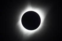 A photograph of the total solar eclipse in 2017, with the sun's corona glowing brightly against a dark sky