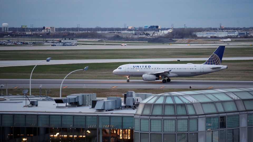  A United Airlines aircraft lands at O'Hare International Airport in Chicago, Illinois on April 11, 2017. 