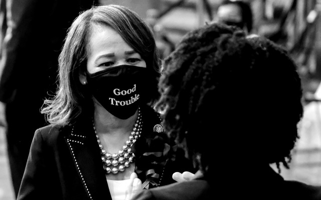 Representative Lisa Blunt Rochester wearing a "good trouble" mask