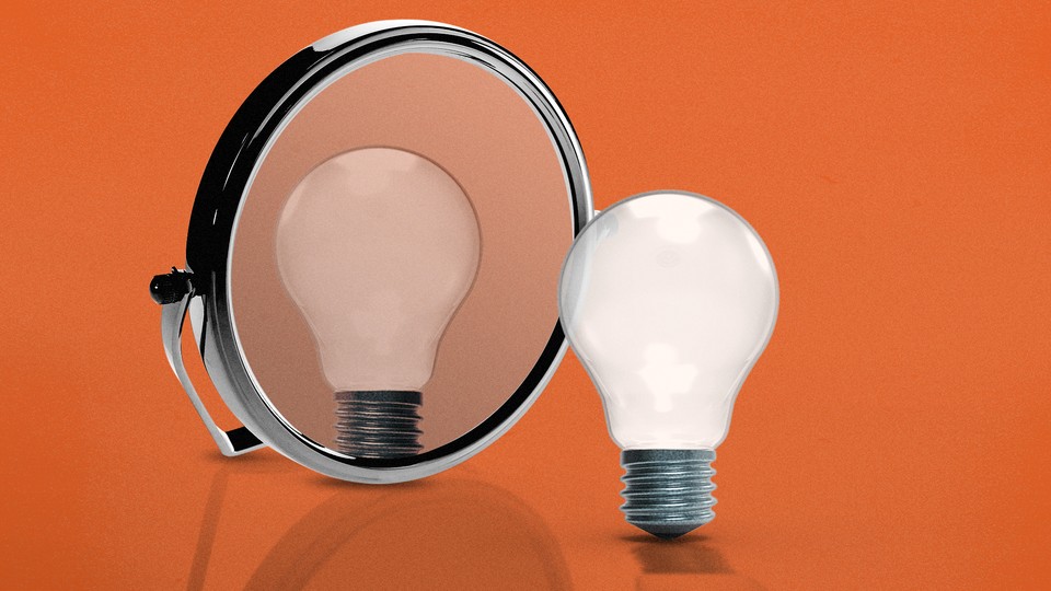 An illustration of a light bulb looking into a mirror