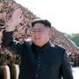 Kim Jong Un waves and smiles 