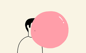 A man blowing a big chewing-gum bubble.