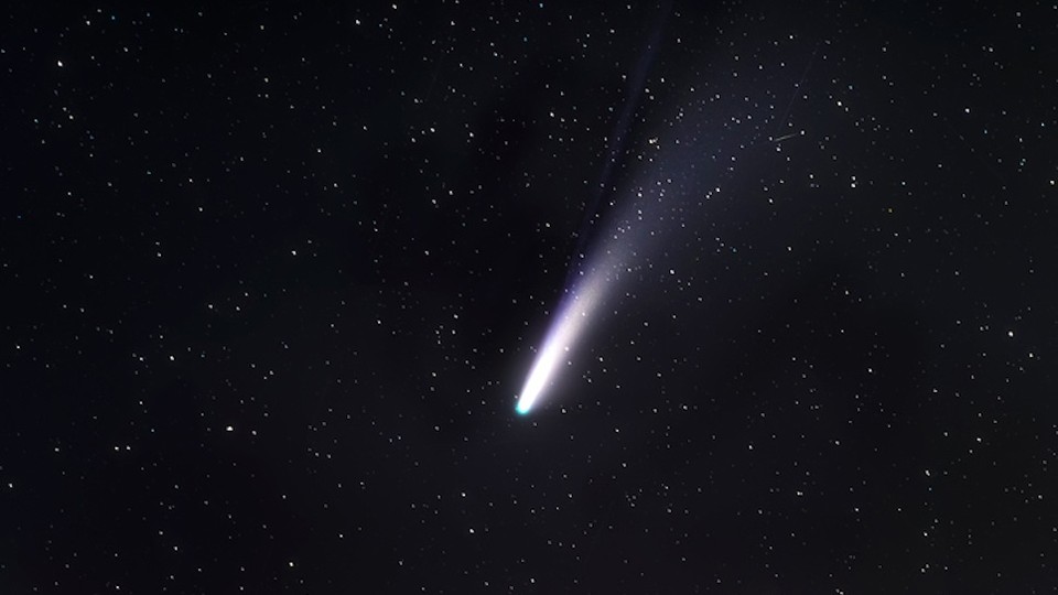 a comet in a black starry sky