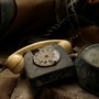 A rotary telephone and clock are seen in the NATO tunnels dating back to the Cold Warbeneath Valletta, Malta, in 2017.