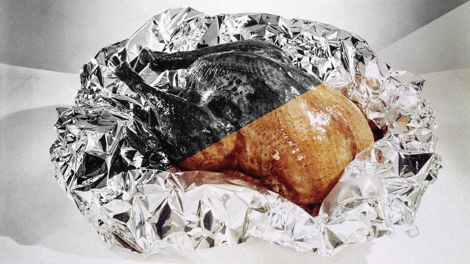 A photo of a turkey wrapped in tinfoil, rendered half in color, half in greyscale
