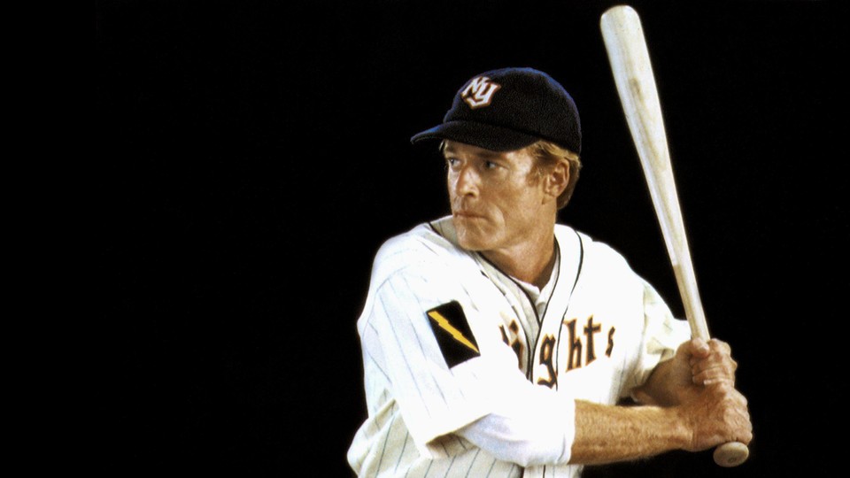 A photo of Robert Redford holding a baseball bat