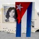 Collage of a photo of a young girl, a Cuban flag, a young boy's photo, and a picture of trees in a field.