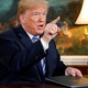 President Trump gestures after signing the memorandum