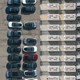 An overhead image of Tesla cars next to Tesla Megapacks