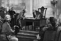 George Washington watches from his desk as a delegate signs the Constitution.