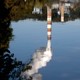 An upside-down reflection of a coal-fired power plant
