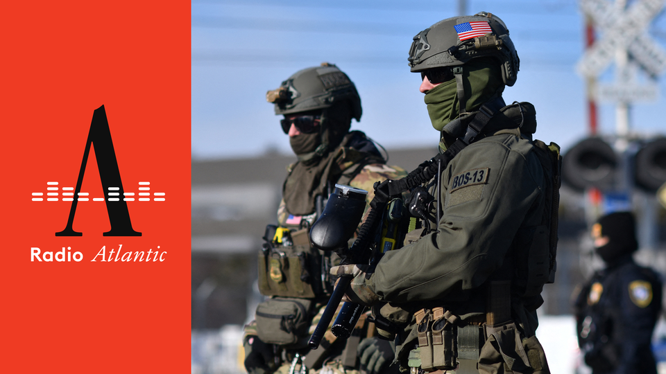 two federal agents with covered faces