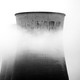 A nuclear power plant partly obscured by fog