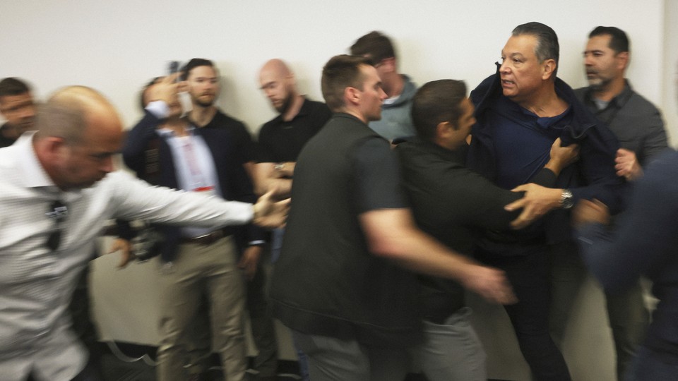 An image of Alex Padilla being forcibly removed