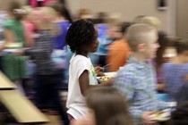 A blurry photo of students in a school cafeteria