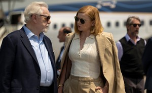 Brian Cox and Sarah Snook near a private jet on 'Succession'