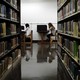 Students sit in a library.