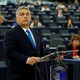 Viktor Orbán stands at a podium while addressing the European Parliament on September 11.
