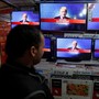An Afghan man watches the broadcasting of the 2016 U.S. presidential election results on TV in Kabul, Afghanistan November 9, 2016.