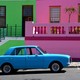 A bright blue car parked in front of pastel pink and green buildings