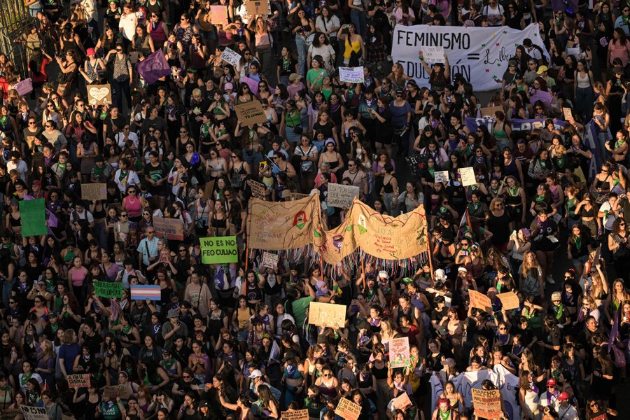 Hundreds of people take part in a march in support of women's rights.