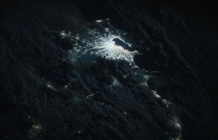 The city lights of Tokyo are seen at night.