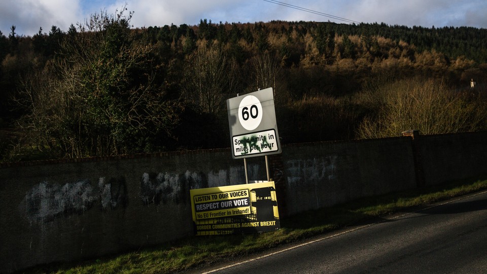 The letters "IRA" are spray-painted on a speed-limit sign.