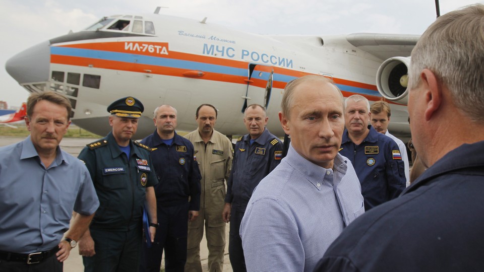 Putin meets with pilots at the airport in Voronezh, which will be renamed for Czar Peter the Great.
