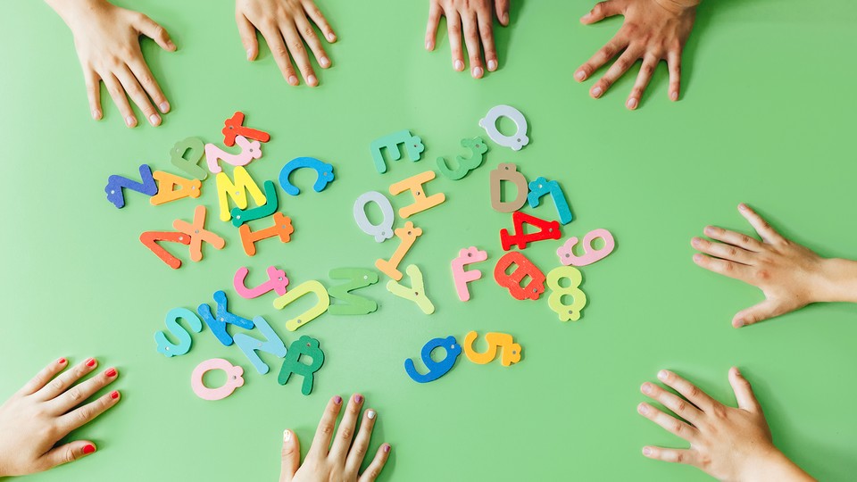 Photo of letters, kids' hands