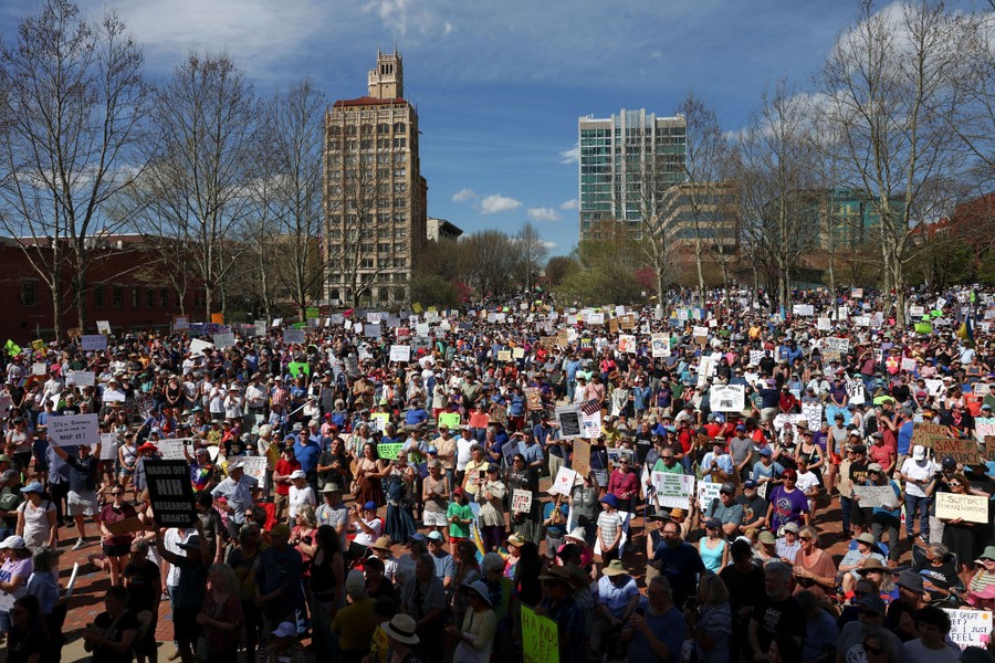 A large crowd of protesters gathered in a city square