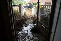A flooded and muddy entryway in a house in North Carolina