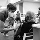 A photograph of an older woman getting vaccinated