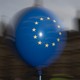EU balloons are waved by anti Brexit campaigners outside the Houses of Parliament in London.