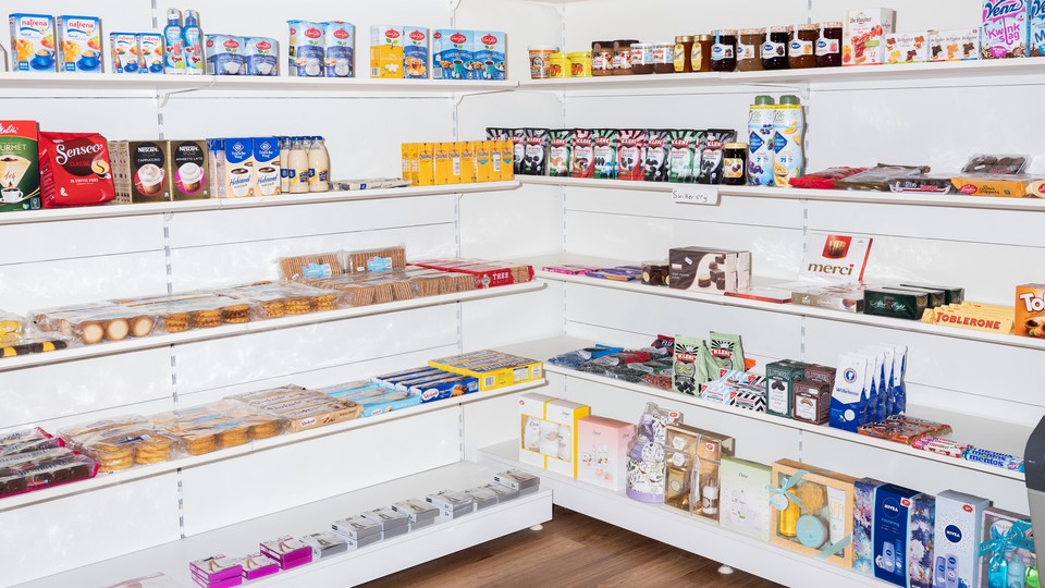 Grocery shelves with many products