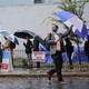 Washington, D.C., voters line up in the rain to cast a ballot in the 2018 midterm elections.