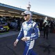 Dale Earnhardt Jr. walks through the garage area before practice for the NASCAR Cup Series auto race at Phoenix International Raceway
